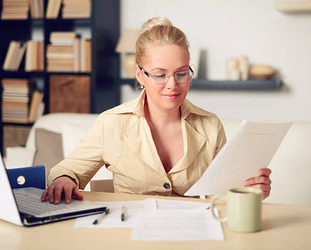 istock blonde woman working at home 538652551