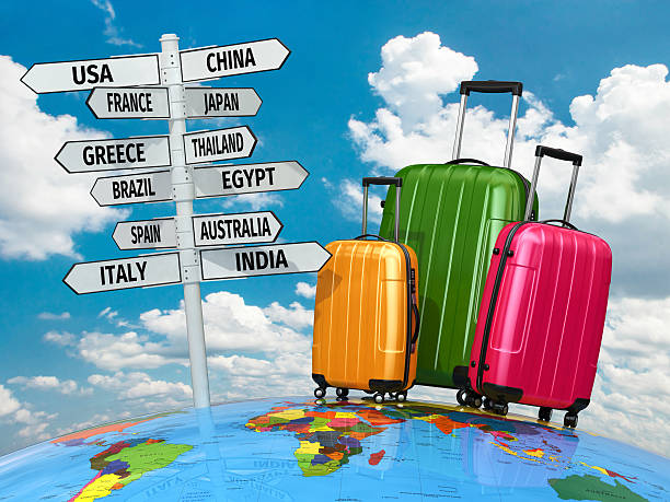 istock Travel concept. Suitcases and signpost with countries. 538653801