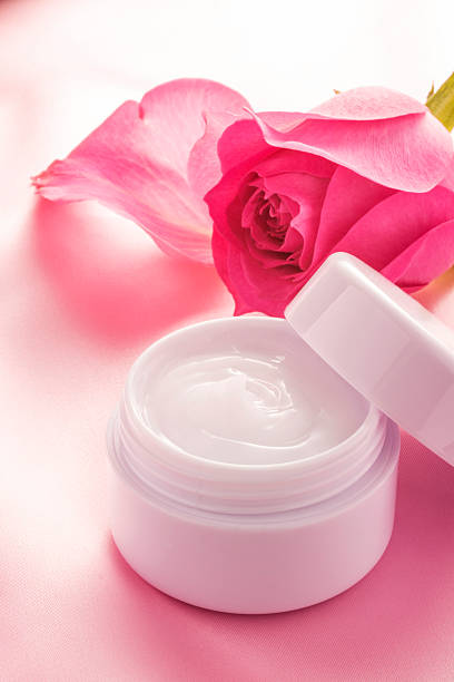 istock Beauty cream and rose on pink cloth 538654716