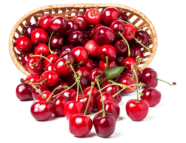 istock cherries in a wicker basket isolated on white background 538655424