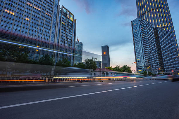 Free Stock Photo of Modern urban street at dusk with traffic light ...