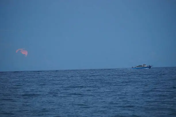 Ship on the ocean in the moon light