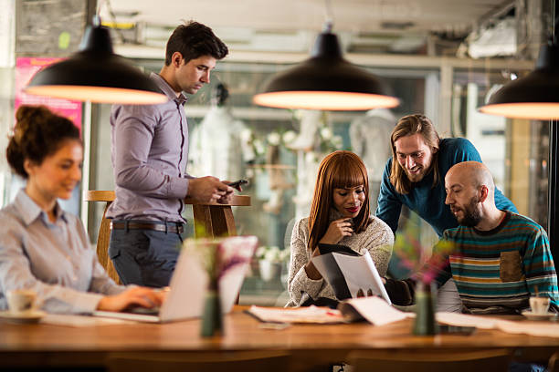 istock Smiling business people reading business reports in the office. 538657754