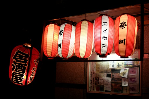 Tokyo, Japan - July 28, 2014; Traditional japanese lanterns outside a small restaurant in a summer night