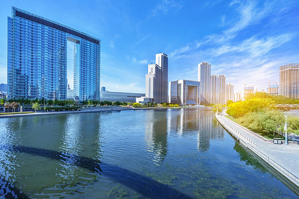 istock Modern buildings and river in urban city 538659548