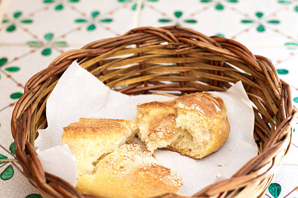 istock Rustic Basket with Bread on Antique Italian Tiles (Close-Up) 538660592