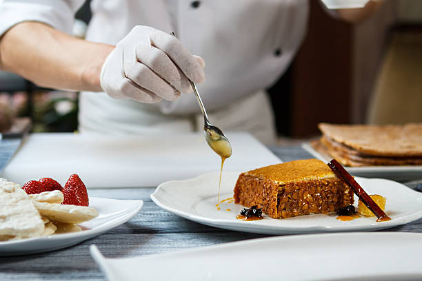 istock Spoon pouring honey on plate. 538661760