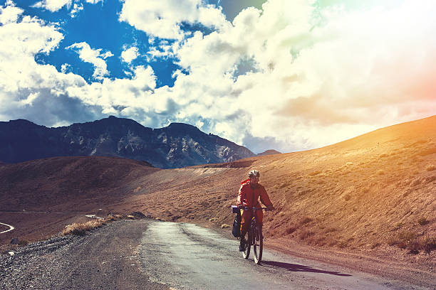 istock Cyclist standing on mountains road. Himalayas, Jammu and Kashmir State 538661792
