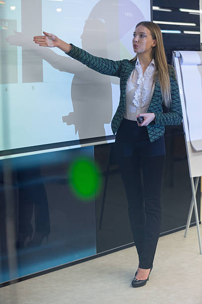 istock Businesswoman holding presentaion using video projector 538663476
