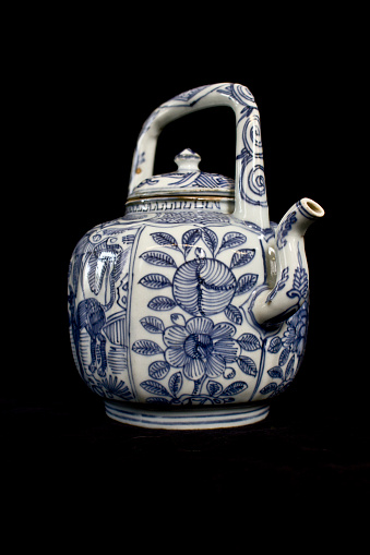 Blue and White Antique Chinese Teapot on Black Background