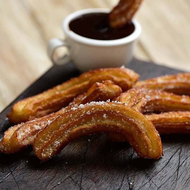 istock churros con chocolate, a typical Spanish sweet snack 538667346