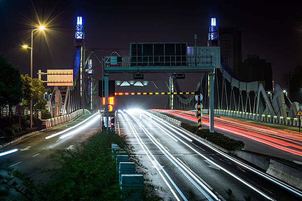 istock highway bridge at night with traces of light traffic 538667492