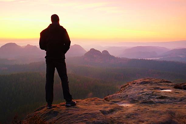 istock Tourist on cliff  in rock empires park  watching  to Sun 538669712