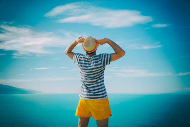 istock Hipster man enjoying on the beach. 538670066