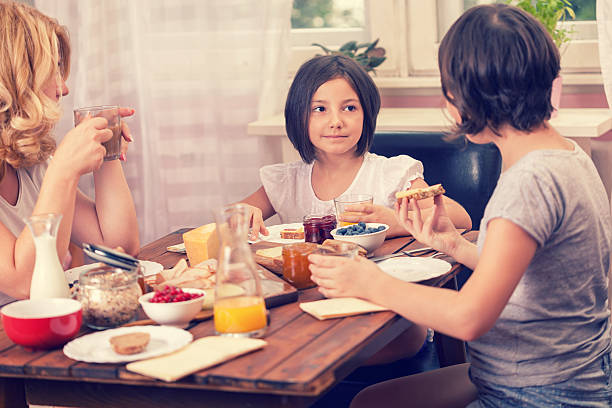 istock Young Happy Family Having Breakfast 538675426