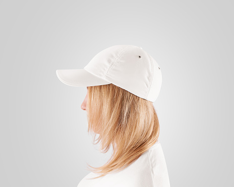 Blank white baseball cap mockup template, wear on women head, isolated, profile. Woman in clear hat and t shirt uniform mock up holding visor of caps. Cotton basebal cap design on delivery guy.