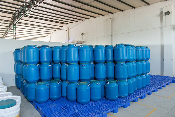 istock Plastic barrels or drums stored in a warehouse 538679064