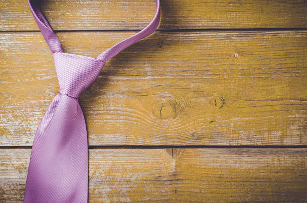 istock Elegant purple tie on wooden background 538679706