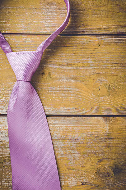 istock Elegant purple tie on wooden background 538680214