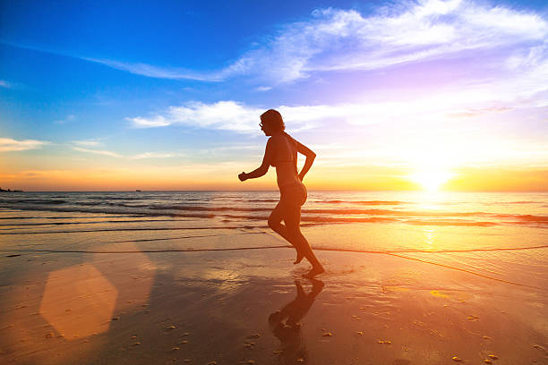istock Young runner woman during amazing sunset. 538682575