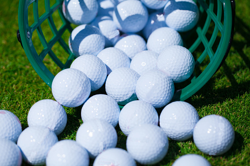 A bucket of golf balls at the driving range