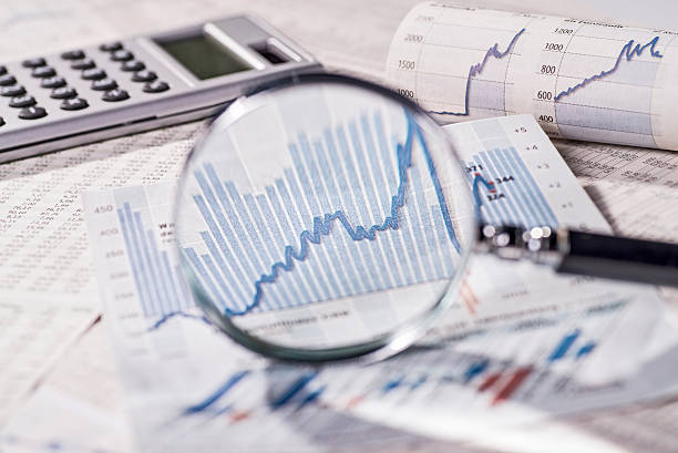 Stock exchange prices in the focus of a magnifier stock photo