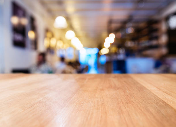 istock Table top with Blurred Bar restaurant cafe interior background 538684262