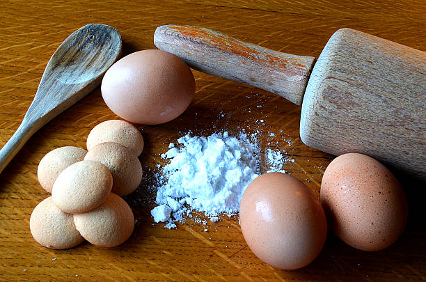 istock Eggs, pound cakes and flour on wooden table 538685581