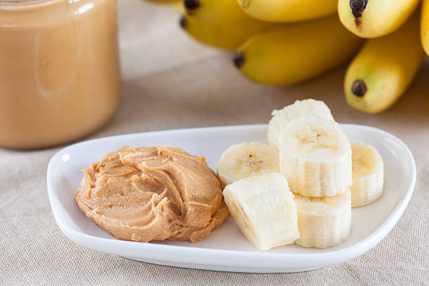 Early Morning Healthy Breakfast Early Morning Healthy Breakfast. Homemade peanut butter and bananas. peanutbutter stock pictures, royalty-free photos & images