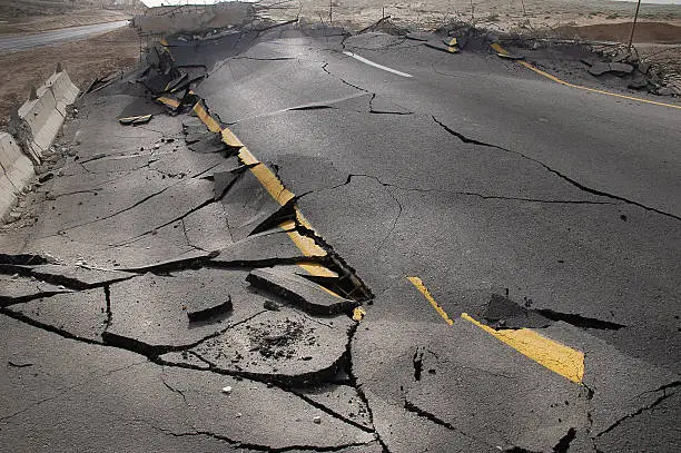 Photo of cracked asphalt after earthquake