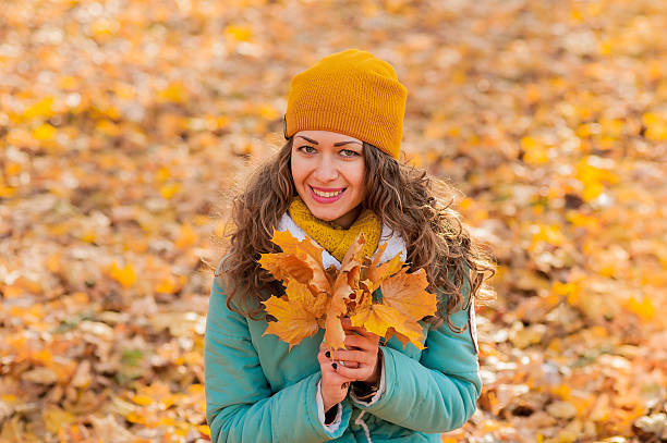 istock Autumn woman on leafs background 538687194
