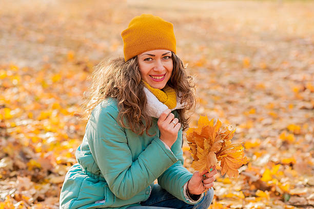 istock Autumn woman on leafs background 538687250