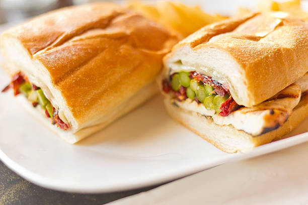 Helsinki Grilled Chicken Sandwich Nutritious Helsinki grilled chicken sandwich with asparagus and sundried tomatoes torpedo sandwich stock pictures, royalty-free photos & images