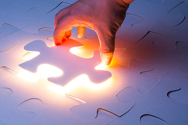 istock Hand holding the last piece of jigsaw puzzle 538689377