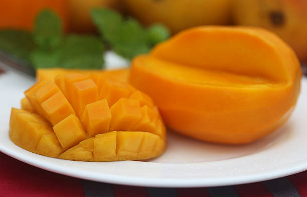 istock Ripe mangoes with mint leaves 538689981