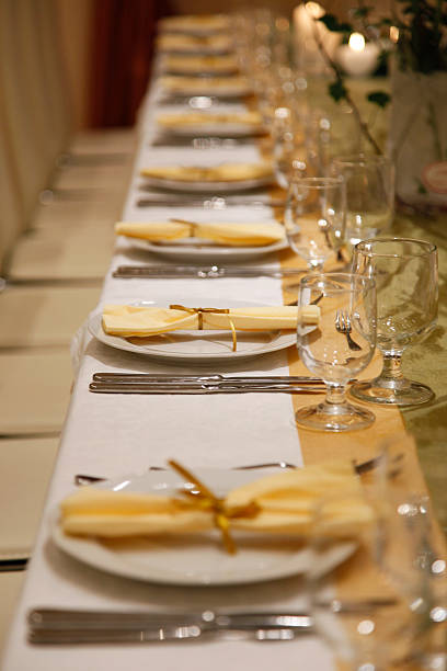istock catering with served plates in row, napkins  and decoration 538690205