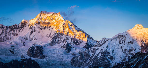 istock Golden light on snowy mountain summits peaks panorama Himalayas Nepal 538691249