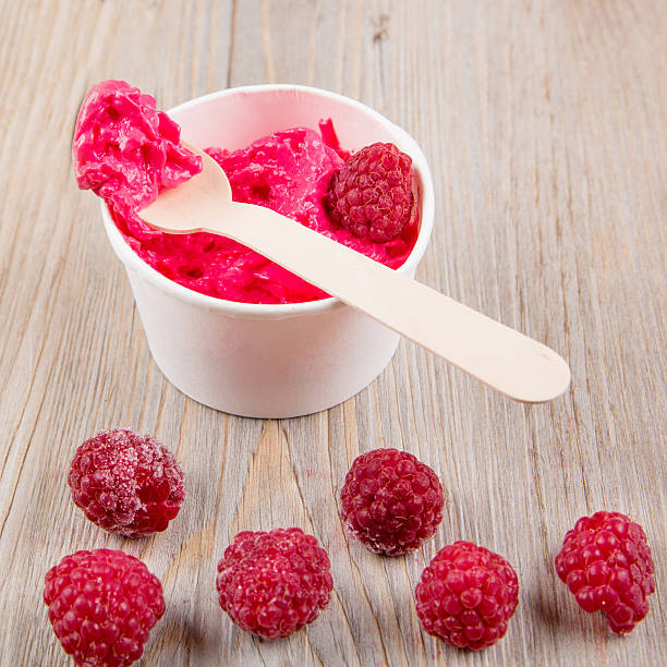 istock Frozen creamy ice yoghurt  with whole raspberries 538701975