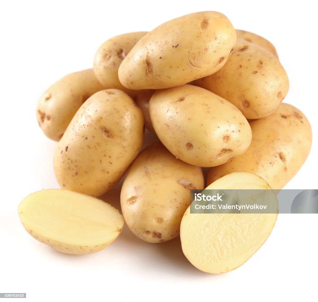 Yellow potatoes with sections. Yellow potatoes with sections on a white background Raw Potato Stock Photo
