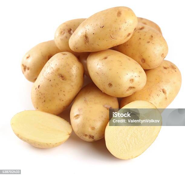 Yellow Potatoes With Sections Stock Photo - Download Image Now - Raw Potato, Gold Colored, White Background