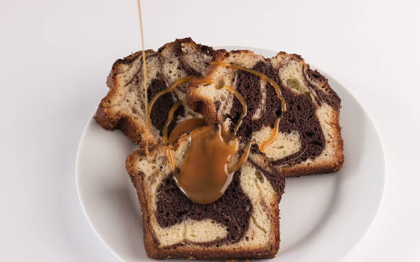istock slices of marble cake with caramel sauce 538703299