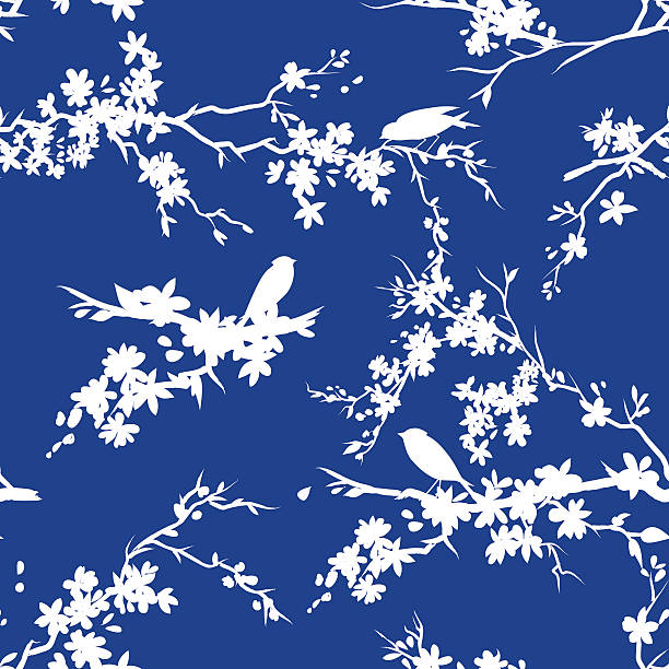 sakura kirsche blüten und vögel nahtlose muster in blau und weiß - tree bird flower pattern stock-grafiken, -clipart, -cartoons und -symbole