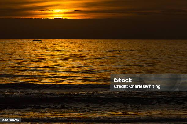 Sunset Silhouette With Sun Clouds Boat And Ocean Stock Photo - Download Image Now - 2015, Beach, Florida - US State
