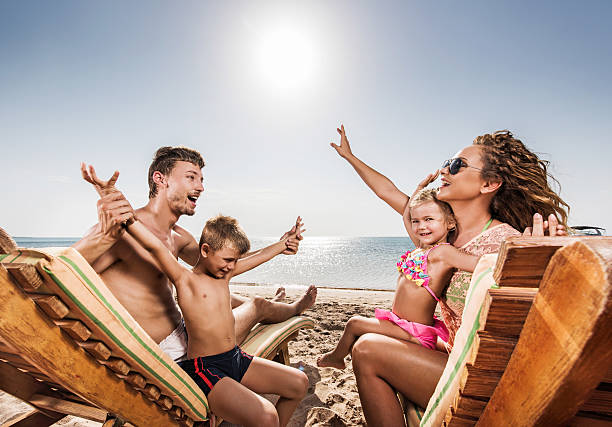istock Playful family in deck chairs. 538707173