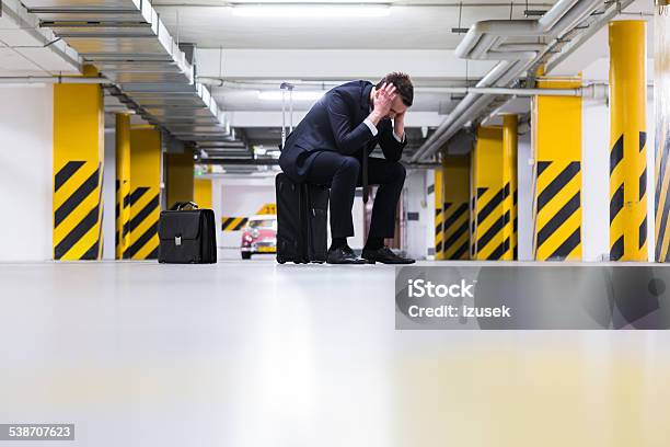Businessman In Underground Garage Stock Photo - Download Image Now - Business Person, Disappointment, Full Length