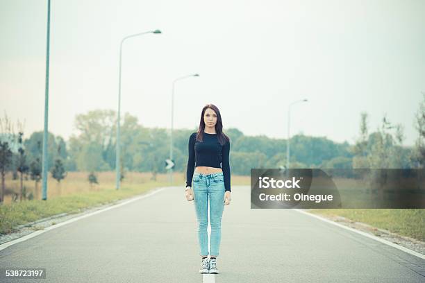 Young Beautiful Brunette Straight Hair Woman On The Road Stock Photo - Download Image Now