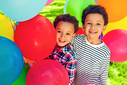 Children with colorful balloons in the park
