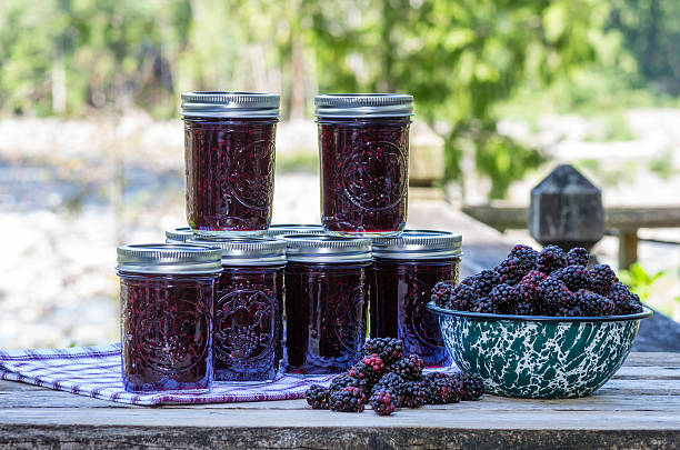 Homemade marionberry jam or preserves Jars of homemade marionberry or blackberry preserves or jam marionberry stock pictures, royalty-free photos & images