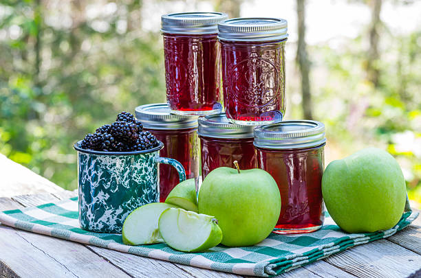 Homemade blackberry apple jam Jars of homemade blackberry and apple jelly marionberry stock pictures, royalty-free photos & images