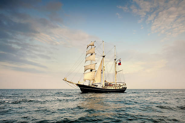 istock Tall Ship under sail with the shore in the background 538745891